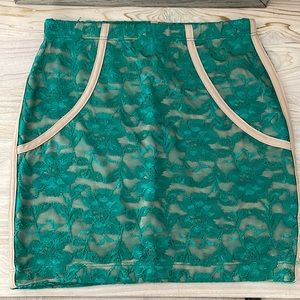 Lulu’s green lace skirt with nude piping and liner
